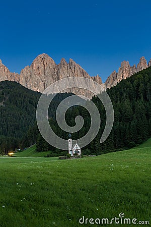 Tiny Church of San Giovanni in South Tyrolâ€™s Val di Funes in front of Dolomite mountain, Italy Stock Photo